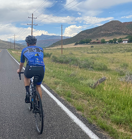 Ricky Romersi, a senior chemistry and environmental science student, rides in Fort Collins, Colorado.