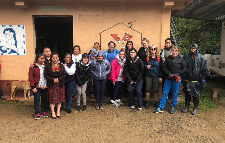 Strockbine with fellow nursing students and community health workers at Curamericas Global’s casa maternal facility in Guatemala, where they document health information from local families.