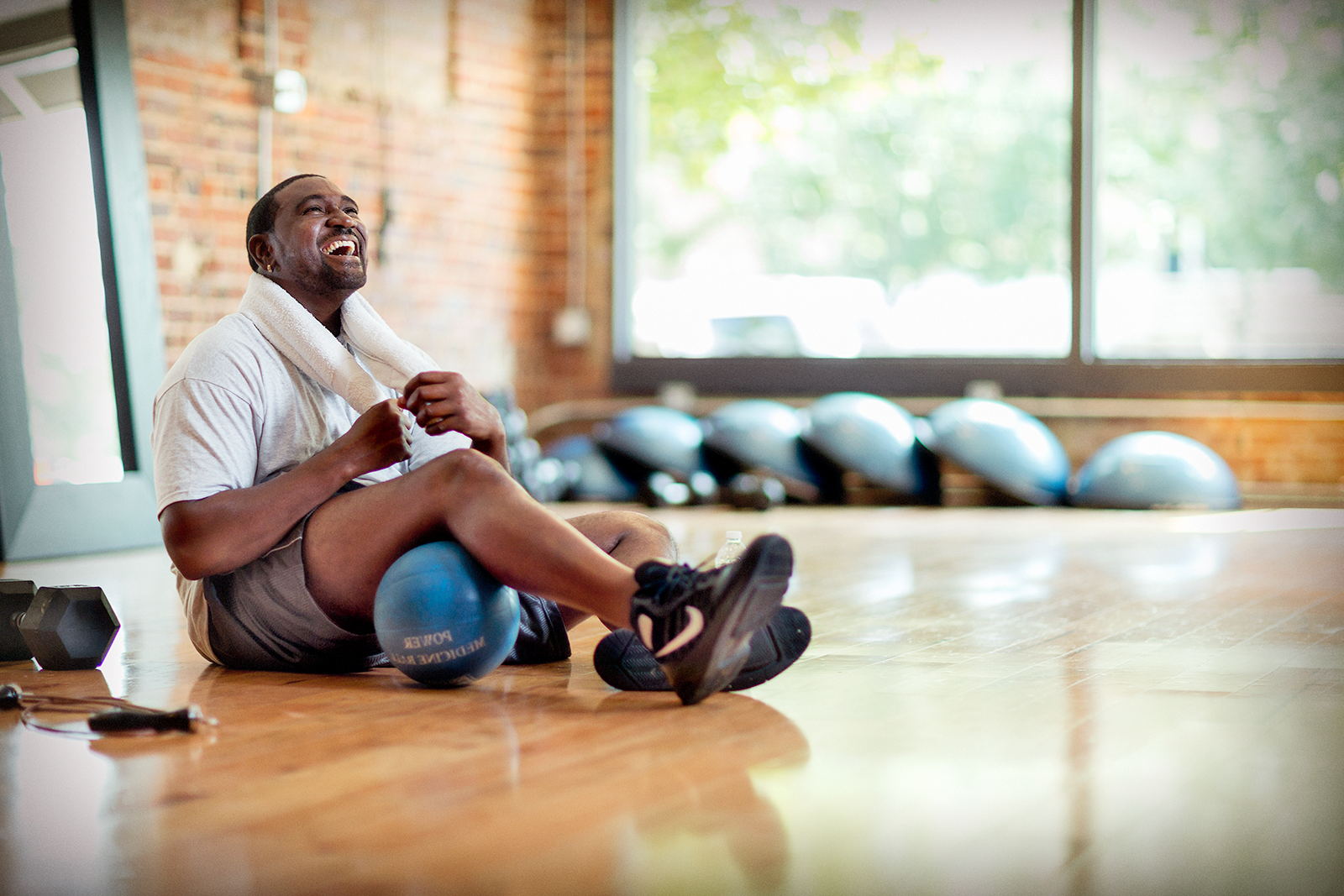 Man laughing in fitness center