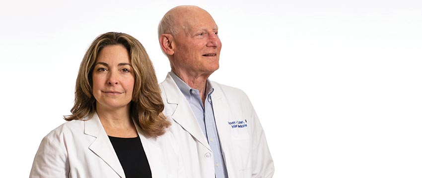Heather Whitson, MD, HS’01-’04 and Harvey Cohen, MD, HS’65-’67, ’69-’71