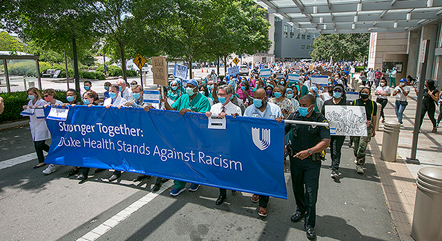 Hundreds of faculty and staff march in the Duke Health Walk for Solidarity, part of the national “White Coats for Black Lives” movement, on June 10, 2020.