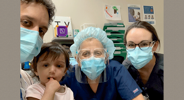 Nimesh Nagarsheth, MD and daughter Kiara with the medical team from Duke Eye Center