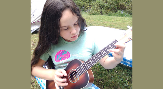Zoe Petko playing ukulele
