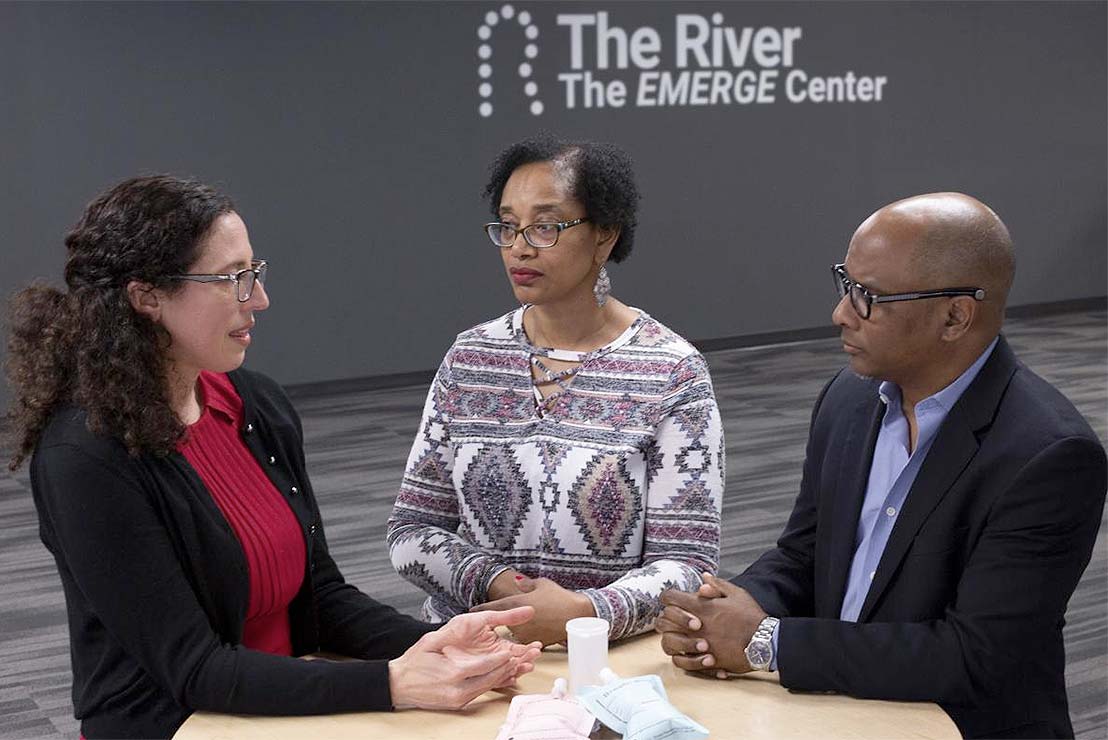 Researcher Meira Epplein (far left) partnered with Durham Pastor Ronald L. Godbee to spread the word about cancer prevention at the River Church. Gilda Suiter (center) benefited from a simple test and preventative treatment. (Photo: John Hansen)