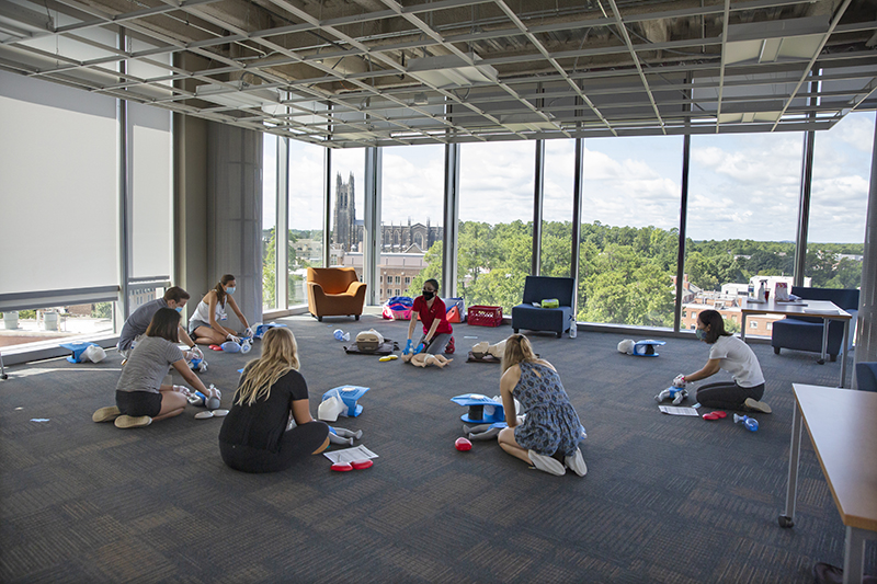 First-year medical students meet in a small groups, wear masks, and maintain social distancing during a Basic Life Support session in the Trent Semans Center for Health Education. Photo by Shawn Rocco.