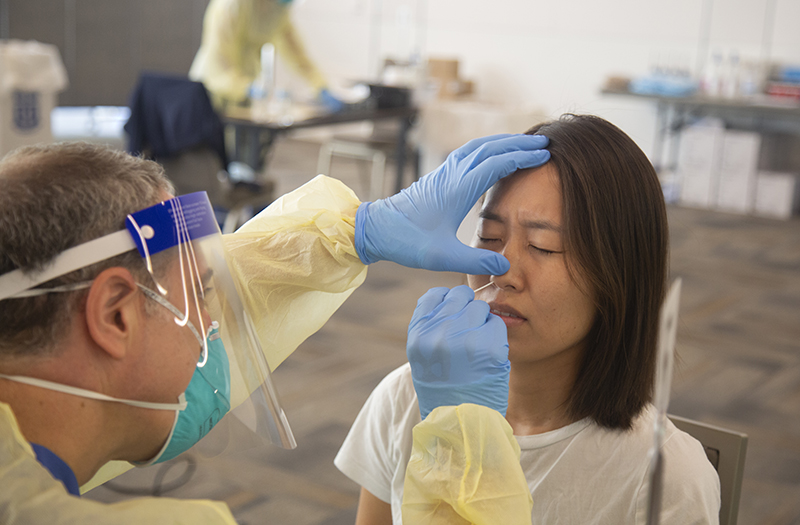 First-year medical student Maggie Min gets a COVID-19 test before the start of the semester. Photo by Shawn Rocco.