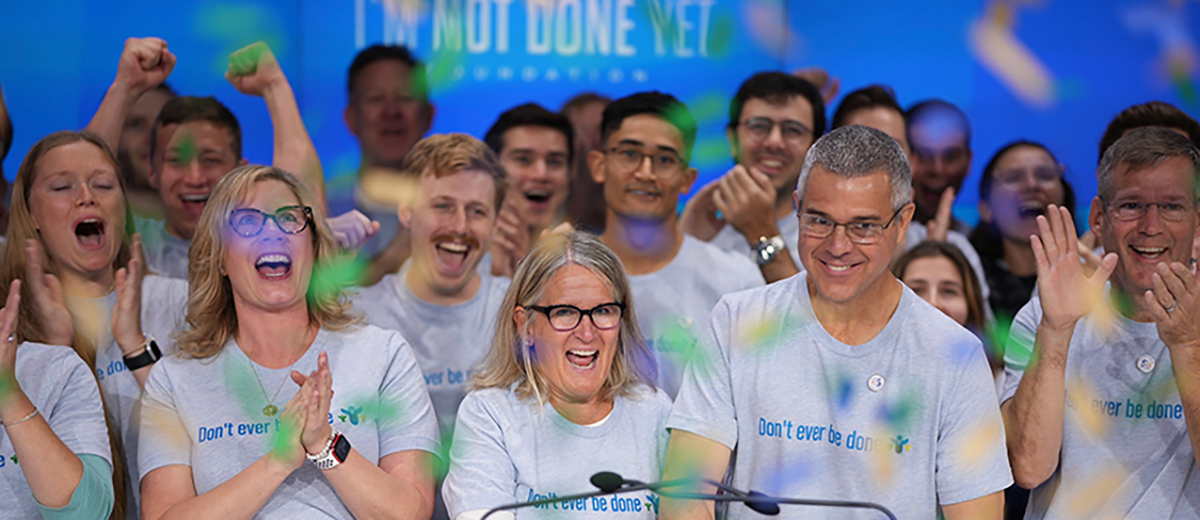 people in foundation t-shirts celebrating the nasdaq opening bell