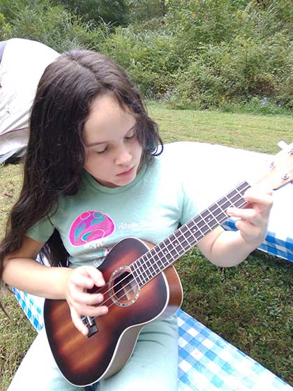Zoe Petko playing ukulele