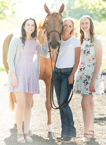 Elianna Kirson (right) with her mom, Sarah; sister, Talia; and horse Irma. 