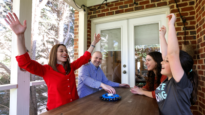 Talia Aron, MD, with her husband and two daughters.