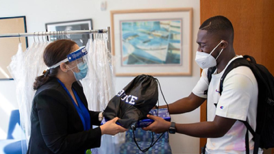 Prince Boadi receiving an orientation package as a new medical student