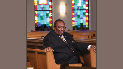 James "Jimmy" Barnes sitting in a pew at church