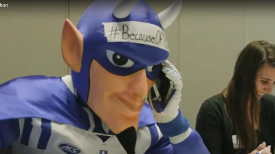 Duke Blue Devil on the phone at the Thank-a-thon