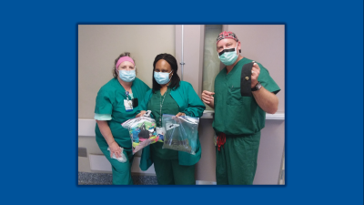 Nurses holding gifts from the community