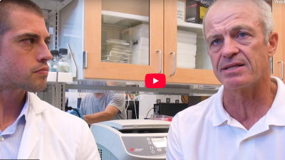 video still of Jason Somarelli, PhD, with Paul Rudershausen in Jason's lab