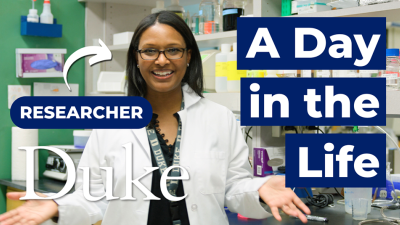 Video screenshot of Erica Washington, PhD, with "researcher" and an arrow pointed at her with "A Day in the Life"