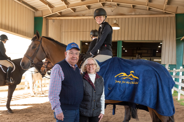 The Pettys with Anna Tyler, a young rider currently taking lessons at Triangle Farms.