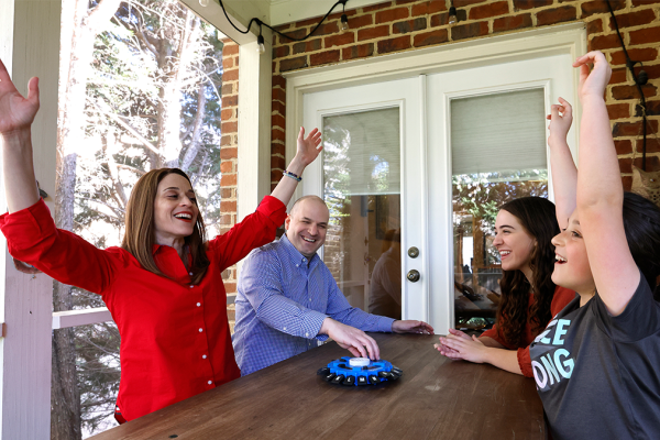 Talia Aron, MD, with her husband and two daughters.