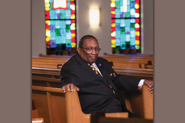 James "Jimmy" Barnes sitting in a pew at church