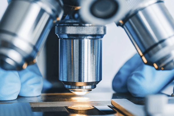 Close up of a compound microscope's lenses