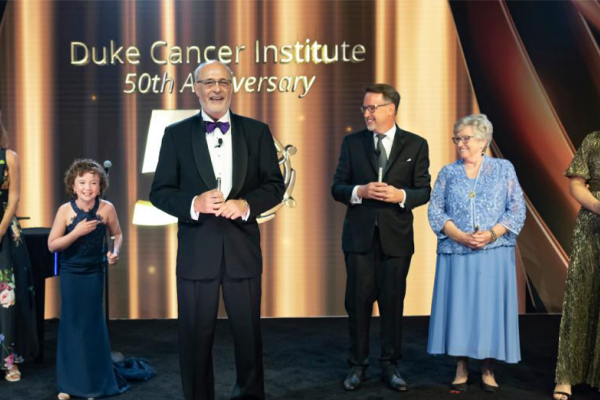 Michael Kastan and guests on stage at the DCI 50th anniversary celebration