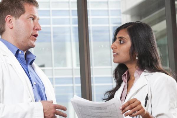 Two researchers consulting on a project. 
