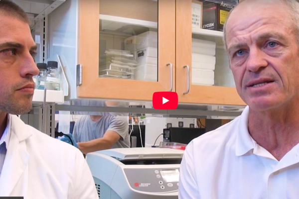 video still of Jason Somarelli, PhD, with Paul Rudershausen in Jason's lab