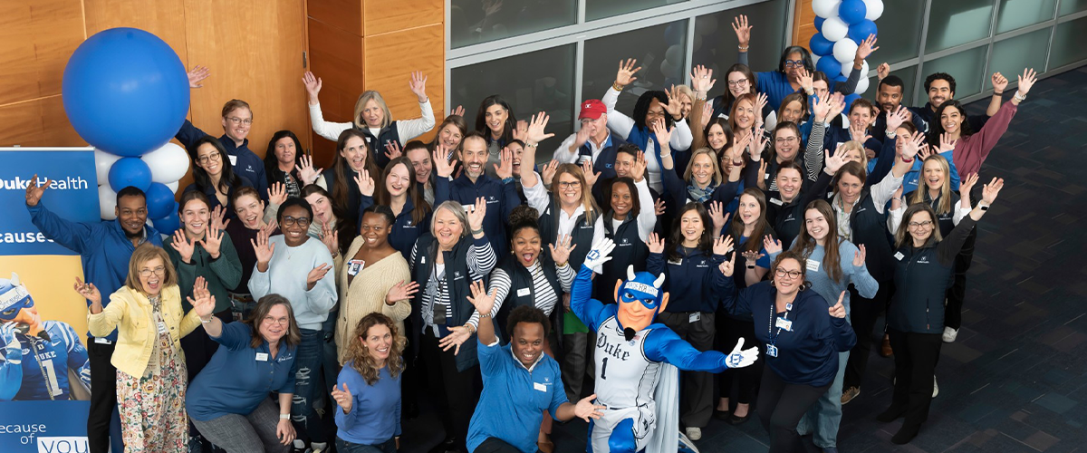 Group photo of volunteers and the Duke Blue Devil expressing their thanks