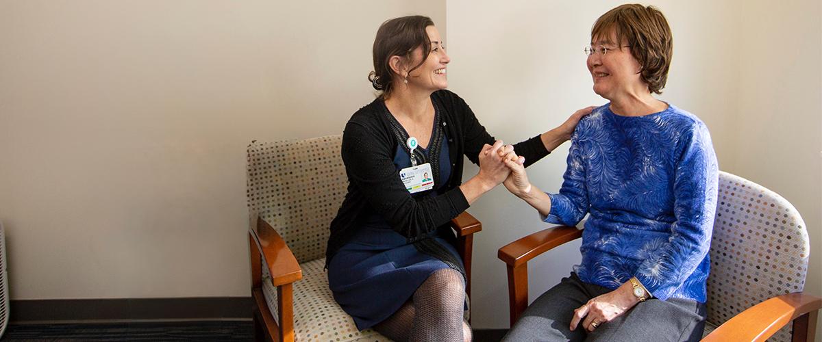 a provider and patient sitting together having a conversation.