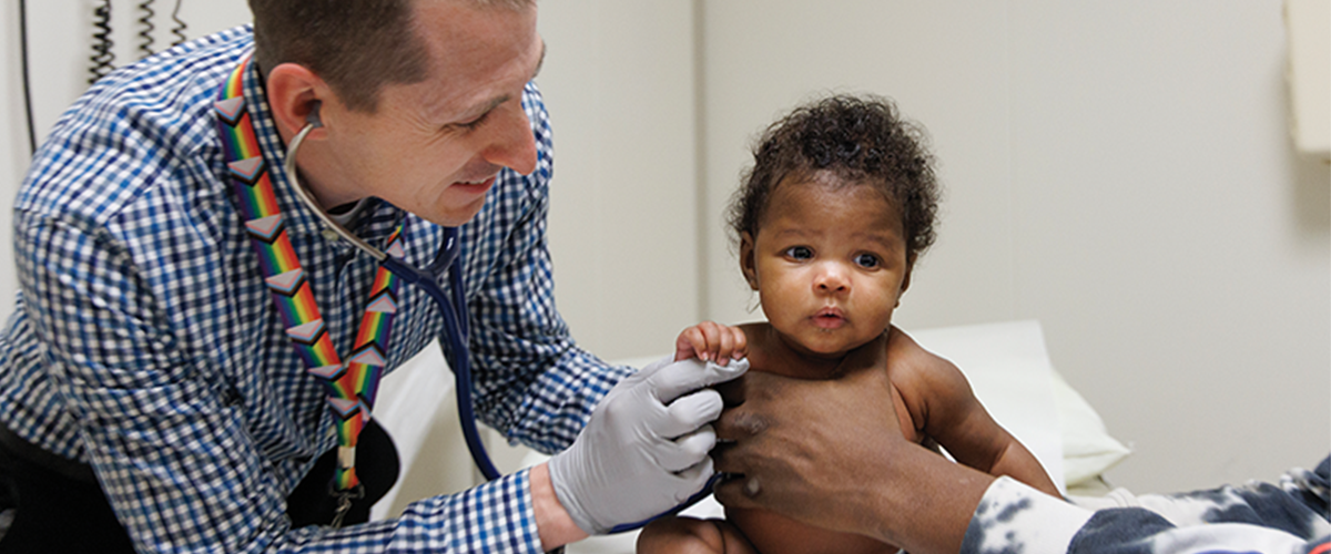 Doctor performing a medical exam on baby