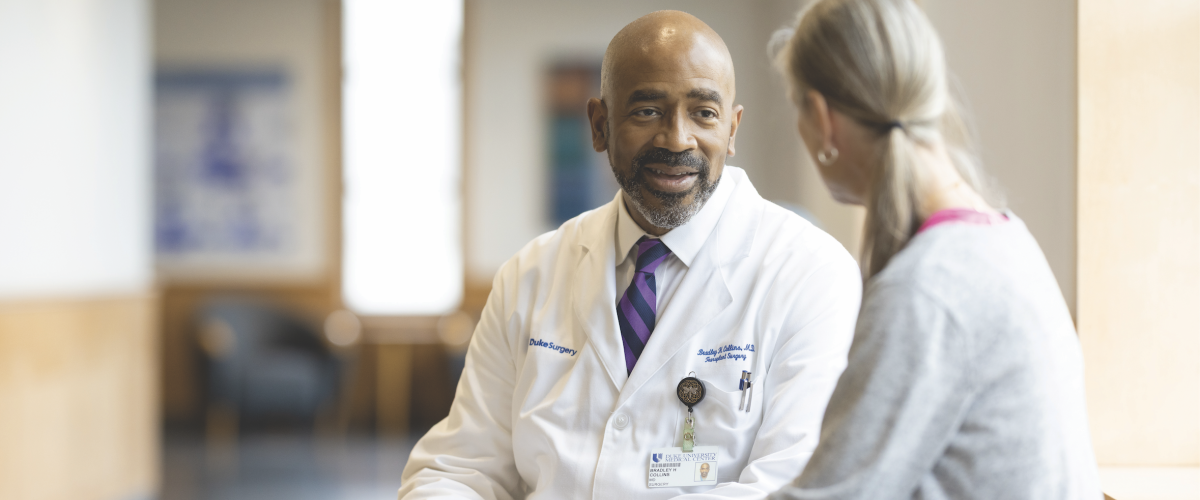 A provider and a patient having a conversation.