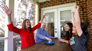 Talia Aron, MD, with her husband and two daughters.