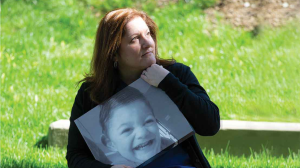 Stacy Sorensen holds a photo of her son Ryan, who passed away.