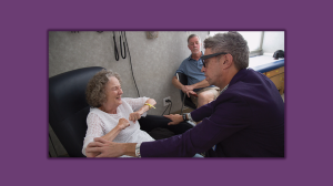 Richard Bedlack, MD, PhD, checks on a patient at the Duke ALS Clinic in Durham.