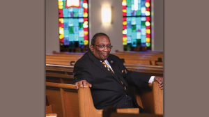 James "Jimmy" Barnes sitting in a pew at church
