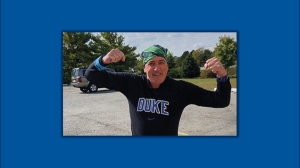 John Harkey posing with arms flexed