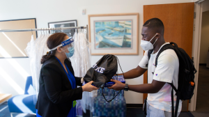 Prince Boadi receiving an orientation package as a new medical student