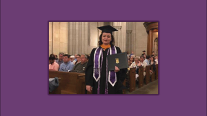 Samantha Casper in a cap and gown holding a diploma