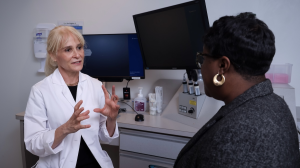 Dr. Esen Akpek speaking with a patient. 