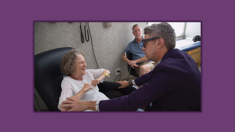 Richard Bedlack, MD, PhD, checks on a patient at the Duke ALS Clinic in Durham.