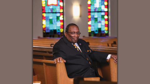 James "Jimmy" Barnes sitting in a pew at church