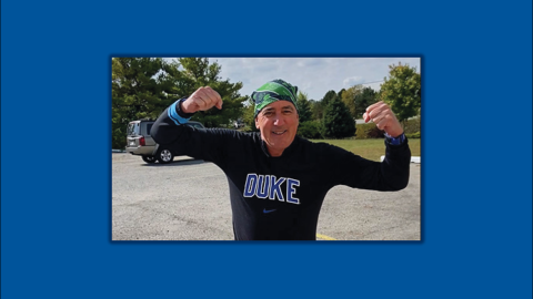 John Harkey posing with arms flexed