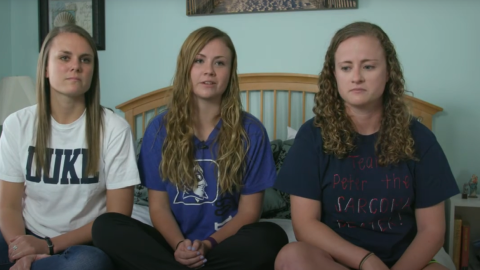 Peter Morrisette's three young adult daughters sitting together on a bed