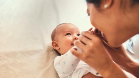 baby and mother looking at each other