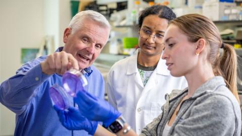 McDonnell discusses research with postdoctoral fellow Vaishnavi Subramanyan, PhD, and graduate student Jill Caiazzi. 