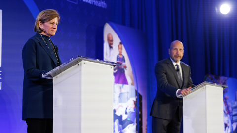 Mary Klotman, MD, and Craig Albanese, MD, MBA, welcome guests from the podium