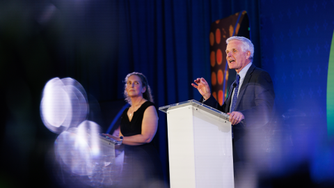 Suzanne Wardell, PhD, and Donald McDonnell, PhD, tell a story from the stage