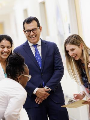 Image of members of the pediatric gastroenterology team laughing as a group