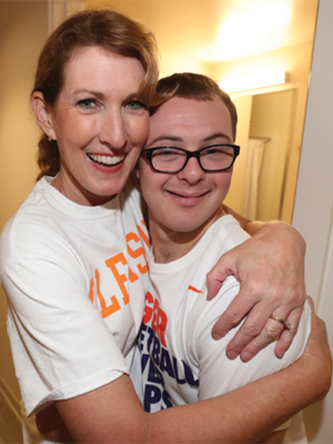 Frankie receiving a hug from his mother. 