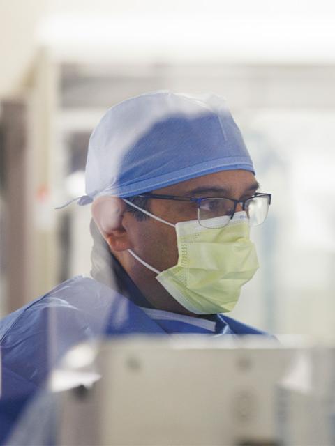 a doctor wearing scrubs and a mask